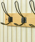 Super Sturdy Wall Mounted Coat Rack With Four Heavy Duty Hooks showcases three black hooks on a natural wood base.