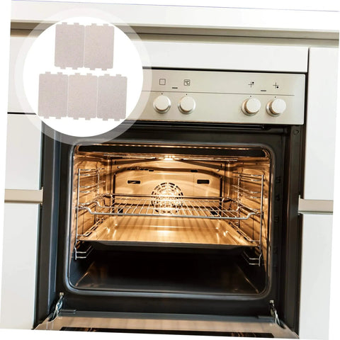 Open oven showcasing the Five Pack Microwave Oven Mica Plates And Sheets Set, heat resistant insulation for home appliances.