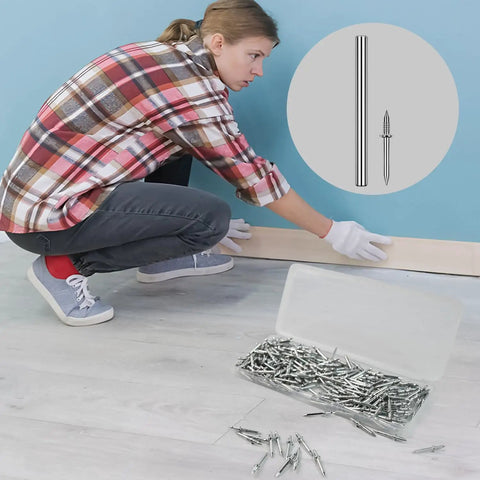 Woman installing baseboards using 250 Pack Double Headed Skirting Nails Made Of Premium Carbon Steel for a seamless look.