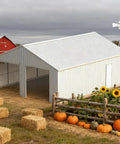 Tough As Nails Heavy Gauge Metal Garage Barn Shed With Reinforced Steel Frame For Rv Pickup Truck Atvs Boat Lawn Mower Garden Tools And Backyard Storage Setup, 33x25x14 ft, surrounded by pumpkins and sunflowers.