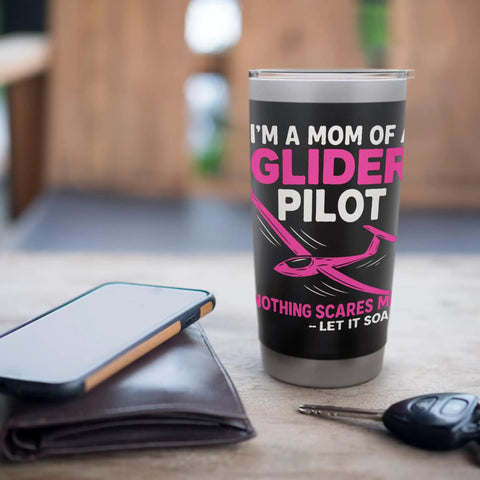 Proud Mom Of A Glider Pilot Insulated Stainless Steel Tumbler on table with phone and keychain, for soaring enthusiasts.