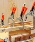 Super Tough Locking C Clamp Pliers Set Inch Duty Woodworking Face Tool With Rotating Pads For Welding And Pocket Hole Joinery Projects That Are 14 Inches Long with orange grips holding wood.