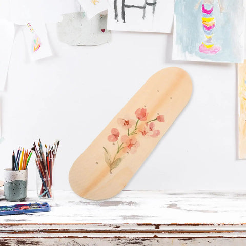 Blank Unfinished 7 Ply Wooden Skateboard Deck With Double Tail For Art Painting And Do It Yourself DIY Custom Builds Replacement Deck For Home Decor And Creative Projects, decorated with floral painting, displayed on a table.