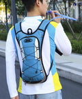 Person wearing Hydration Pack For Outdoors With Water Bladder, Lightweight Hiking Backpack For Running, Blue, adjustable straps