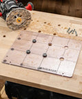Spaced Dog Hole Router Template For Precise Holes And Bench Tools Like Dogs Cookies And Holdfasts on a woodworking bench