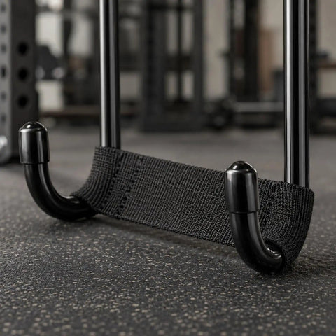 Dumbbell Hook For Pain Free Grips Non Slip Anti Fatigue Weightlifting Accessory With Solid Iron Build close-up on gym floor.