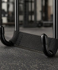 Close-up of Non Slip Dumbbell Hook Grip Aid For Weightlifting, Iron Training Accessory in home gym setting