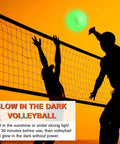 Portable 12ft Volleyball Training Net For Hitting And Serving Drills at sunset with glow in the dark ball in use