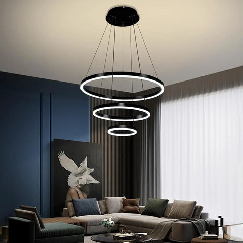 Slick Black Circular LED Pendant Light With Adjustable Height, Modern Chandelier Ceiling Fixture for living room ambience.