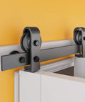 This heavy-duty 40 inch bifold barn door hardware kit fits two 18 inch doors, delivers space-saving versatility, smooth top-mount rollers, whisper-quiet operation, and rust-resistant coating for closets and rooms, close-up view of top-mount roller.