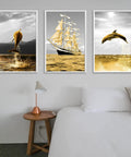 Golden dolphin and sailing ship artwork above modern bedroom side table