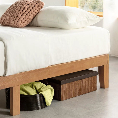 Queen Platform Bed Frame Low Profile Solid Pine Wood with storage baskets beneath for towels and linens.