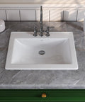 Slick White Ceramic Drop In Bathroom Sink 21 By 18 Inch Rectangle Basin with chrome faucet on gray countertop.