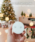 Person holding Mini Remote Control Outlet Plug Adapter With 656ft Range Wireless Light Switch in holiday decorated room.