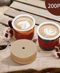 Unbleached 3.75 Inch Percolator Coffee Filter Discs, 200 Count, Disposable Brown Paper next to coffee cups