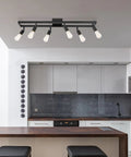 Six Light Adjustable Track Lighting Setup in Matte Black Industrial Farmhouse Style With Pivoting Heads in modern kitchen
