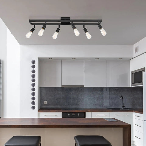 Six Light Adjustable Track Lighting Setup in Matte Black Industrial Farmhouse Style With Pivoting Heads in modern kitchen