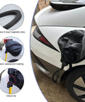 Rock Hard Magnetic EV Charger Port Cover Keeps Your Plugged Rig Dry Through Heavy Downpours And Brutal Sunlight Without Breaking A Sweat And Delivers Foolproof All Season Shielding For Steel Body Electric Models on a white electric vehicle.