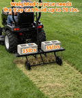48 Inch Tow Behind Dethatcher With 24 Rustproof Tines And Heavy Duty Tires For Lawn Tractors ATVs UTVs in use on grass