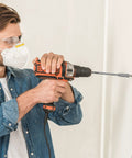 Person using a drill with Four Piece Quarter Inch Spade Drill Bit Extension Set With Hex Shanks for hard-to-reach areas