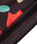 Close-up of fabric texture with colorful design and MILOTO label