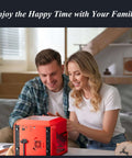 Red compact desktop laser engraver on a table, with a smiling couple using it.