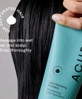 Close-up of a hand holding Acure Ultra Hydrating Shampoo for all hair types with droplets, perfect for locking in moisture.