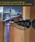 Close-up of Valkynos Conduit Reamer attached to a drill reaming 1/2–1 in conduit pipe.