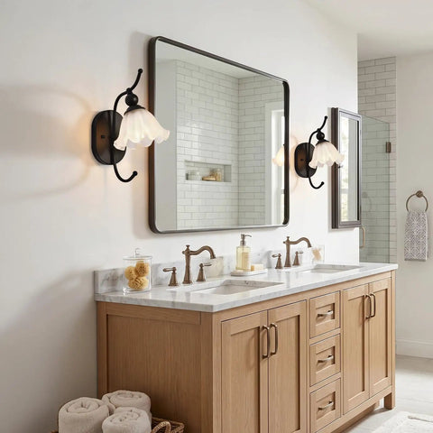 PUMING Black Wall Sconces Set of Two, Vintage Vanity Light Fixture with Flower Glass Shade illuminating a bathroom mirror.
