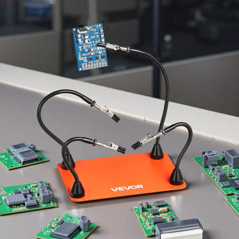 Magnetic Helping Hands Soldering Station with four flexible gooseneck arms and alligator clips holding an electronic board