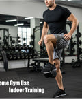 Man using Weighted Dumbbell Ankle Strap For Leg Workouts Two Pack With Adjustable Hook And Loop Fasteners in gym
