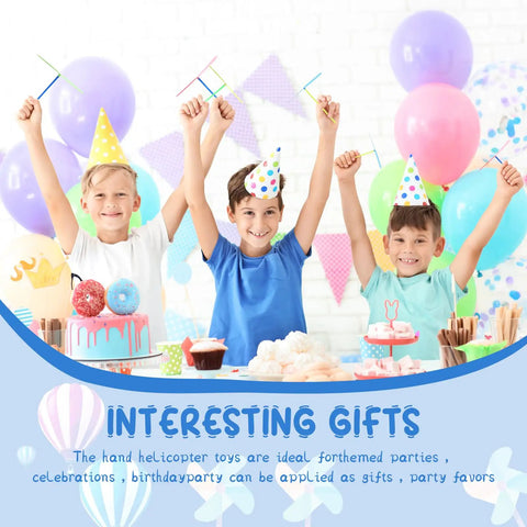 Three kids at a party with Flying Helicopter Toys Set With 50 Propellers And 50 Rods, colorful balloons and cakes in background.