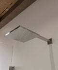 HomeStock Modern Square Solid Brass Shower System with Wall Mount Installation and Brushed Nickel Finish, overhead view of showerhead.