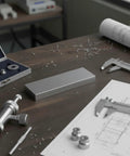 Pro Grade High Steel Gauge Block Set For Precise Measurements, 64 Hardness, 0.5-100mm Range, Ideal For Workshop Calibration And Inspection, Durable Metrology Tool For Hobbyists And Pros on desk with calipers and blueprints