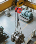 1 Ton Hand Chain Hoist With 10 Ft Lift Height And Galvanized G70 Chain lifting equipment in industrial setting.