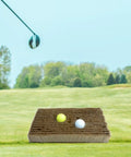 Golf Bunker Practice Mat With Realistic Sand Pit Feel Outdoor Training Accessory for adults on grass with two golf balls.