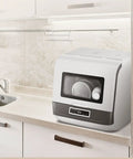 Fully Automatic Countertop Dishwasher With Ultrasonic Scrubbing And Auto Dry on kitchen counter beside sink, compact size and design.