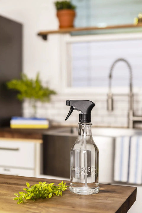 Multi Surface Cleaner Dispenser Starter Kit with 16 oz Glass Bottle in kitchen, countertop view