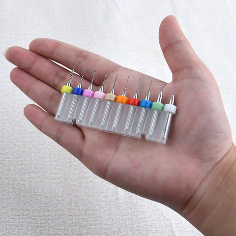 Hand holding 50Pcs PCB Drill Bits Set 0.3mm-1.2mm Carbide Micro Drill Bits For Circuit Boards Engraving CNC Jewelry