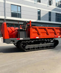 Heavy Duty Mini Crawler Dumper Workhorse With Kickass Hydraulic Dump Bed And Grippy Steel Tracks parked on a job site.