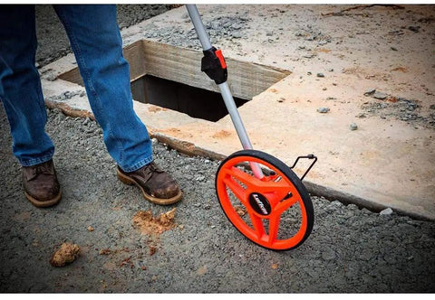 12 Inch Pro SAE Measuring Wheel With Centerline Wheel For Superior Balance And Accurate Readings on a construction site