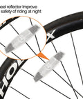 Close-up of white bike wheel spoke reflectors from Six Piece Bike Front And Rear Reflectors Kit For Wheel Spokes Handlebar And Seatpost A No Brainer For Night Cycling High Visibility Water Resistant White And Red.