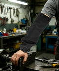 Heavy Duty Fireproof Welding Sleeves Heat Resistant Arm Guards protecting forearm while working on machinery in workshop.