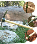 Steel Garden Pickaxe With Wooden Handle For Weeding And Soil Cultivation on grass with close-up of steel blade and wooden handle.