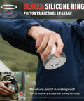 Person holding sealed stainless steel cover of 2250W Alcohol Stove For Camping And Outdoors, demonstrating silicone ring with waterproof feature.