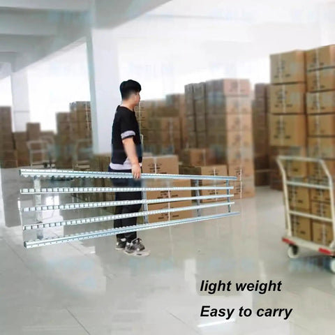 Heavy Duty Foldable Stainless Steel Conveyor Roller For Warehouse And Truck Trailers With 50cm Unloading Pulley being carried by a worker.