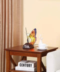 Butterfly Tiffany Style Stained Glass Accent Table Lamp Night Light For Living Room And Bedside Decor 10 Inch Tall With E12 LED Bulb Included Cozy Vintage Glow on wooden side table next to a sofa.
