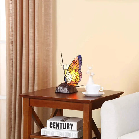 Butterfly Tiffany Style Stained Glass Accent Table Lamp Night Light For Living Room And Bedside Decor 10 Inch Tall With E12 LED Bulb Included Cozy Vintage Glow on wooden side table next to a sofa.
