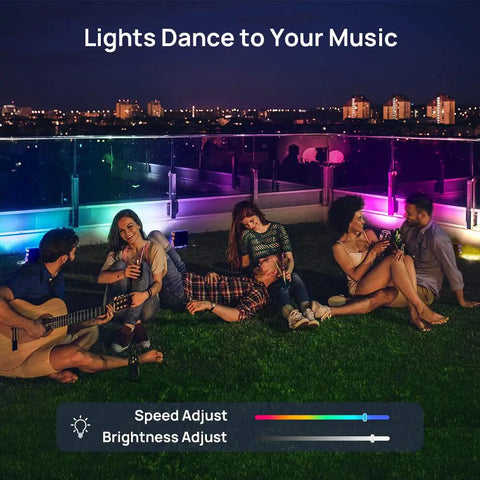 Group enjoying party with Smart WiFi RGB LED Flood Lights Outdoor With App Control And Alexa, IP66 Waterproof uplights on lawn.