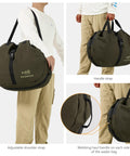 Wader Bag Foldable with Changing Mat and Shoulder Strap for Fishing Travel and Hunting; shown being carried by model.